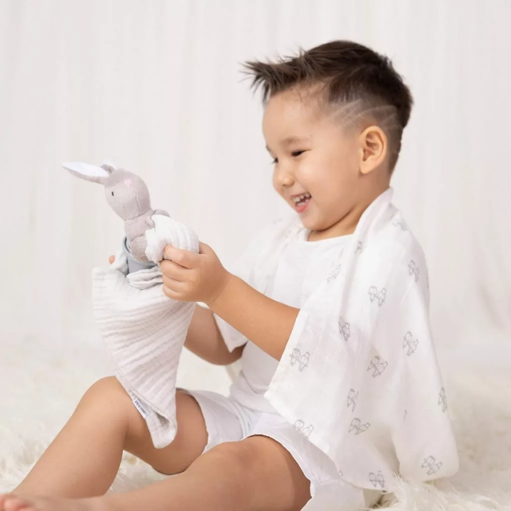 little boy wit muslins and hop hop