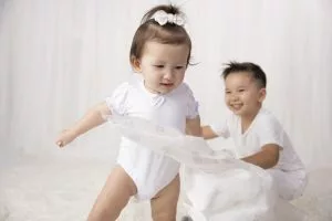 children playing with muslins - What Is Extra-Long Staple Cotton?
